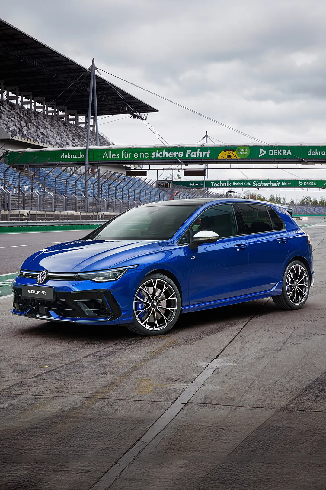 A blue Golf R parked on a race track