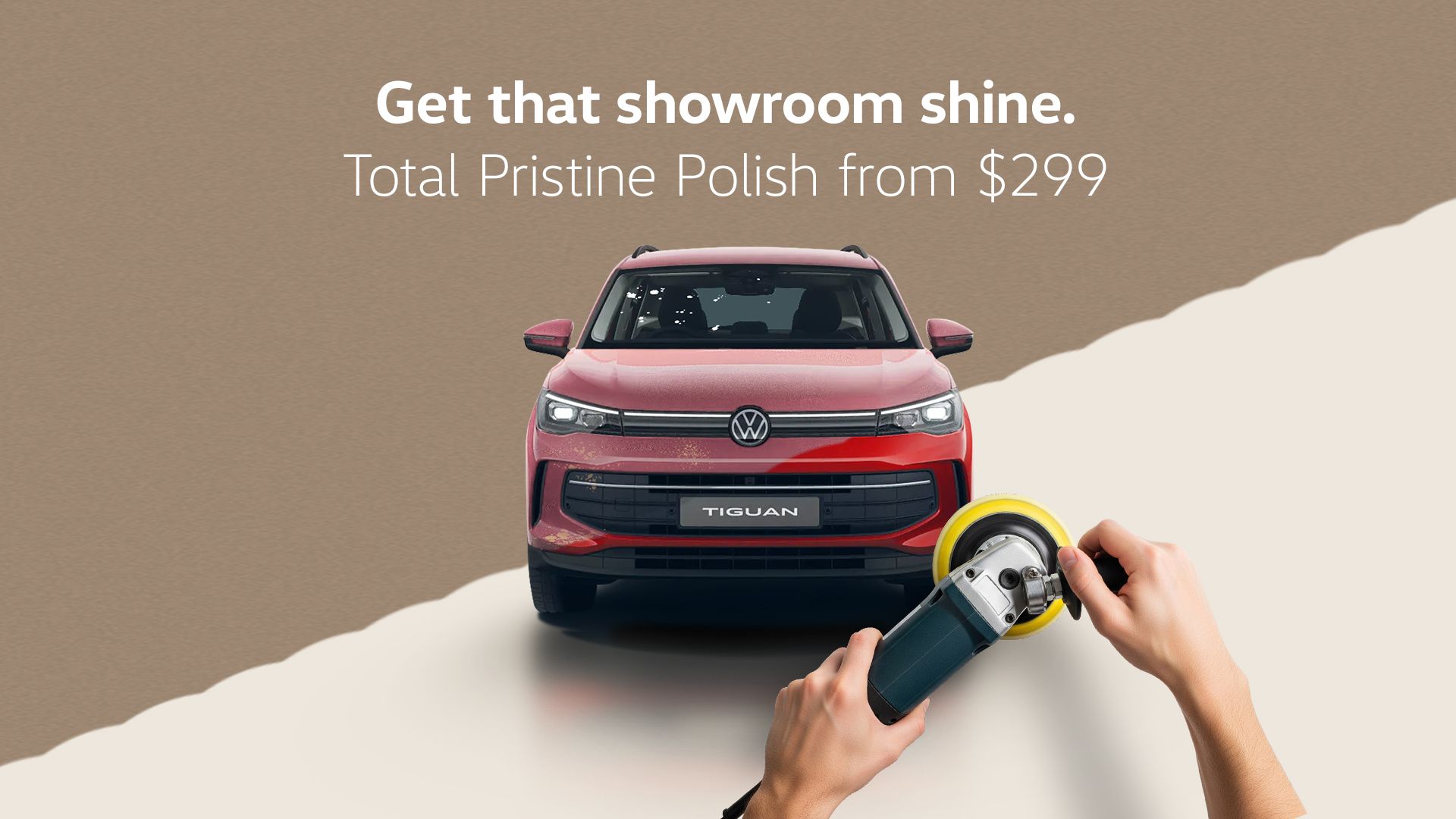 A red tiguan being polished by a Volkswagen expert