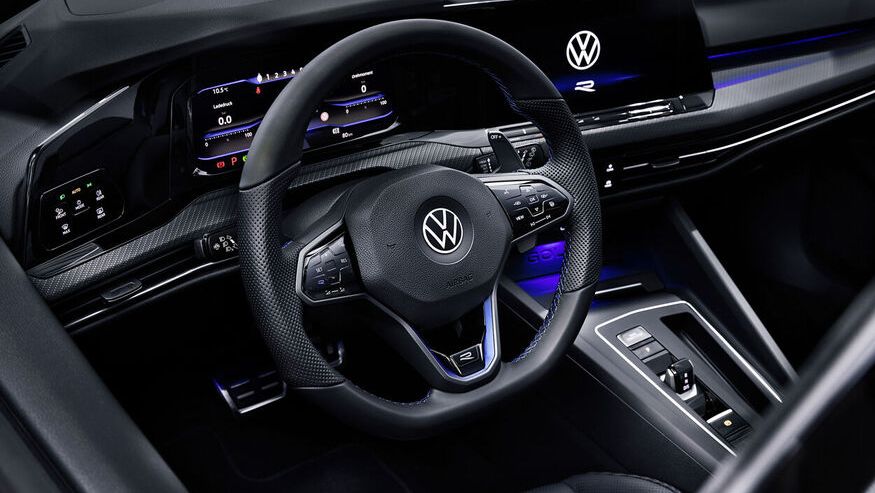 The Golf R interior design with the Volkswagen logo on the sporty leather steering and fewer buttons to navigate on the dashboard