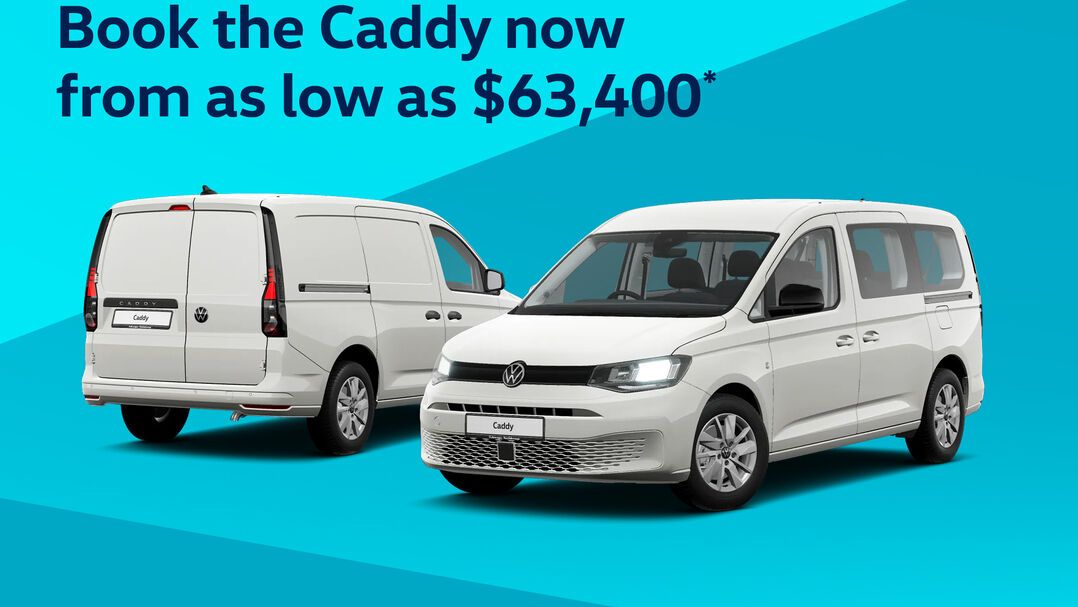 Two white Volkswagen vehicles next to each other with a blue geometric background