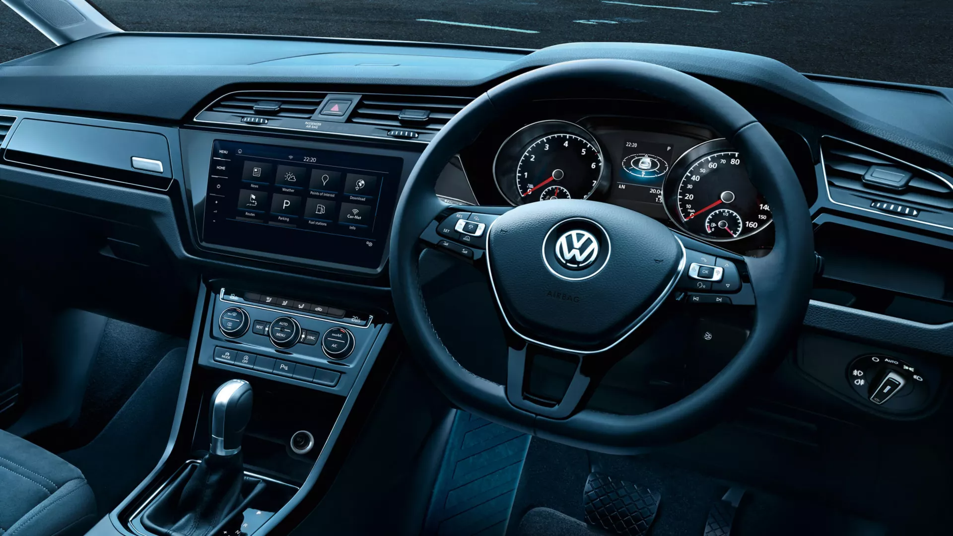 A close-up look of a Volkswagen vehicle's interior cockpit area highlighting its multifunction steering wheel.