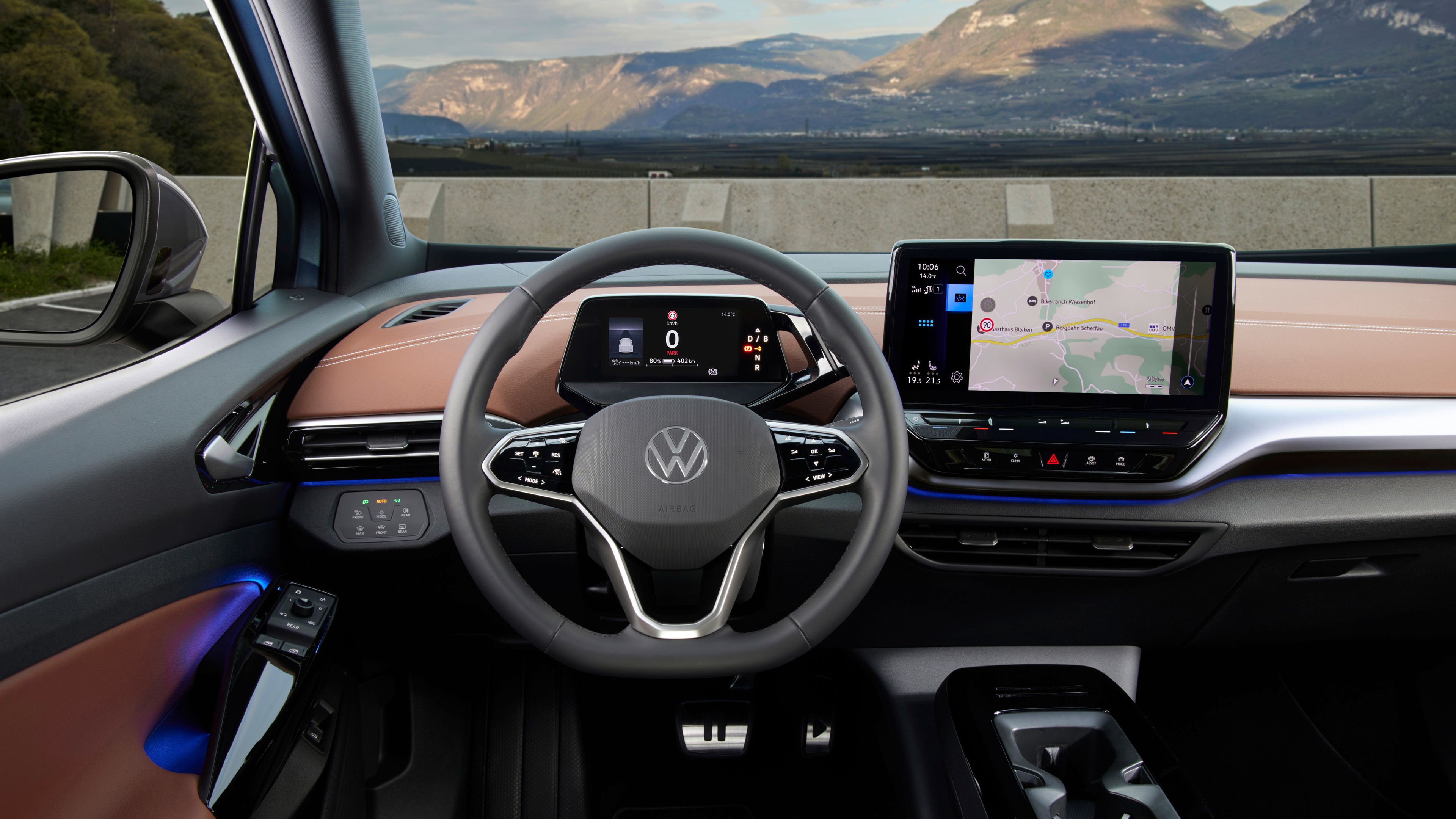 A wide, detailed view of the comfortable interior of the Volkswagen ID.5 the steering wheel and innovative touch screen display 