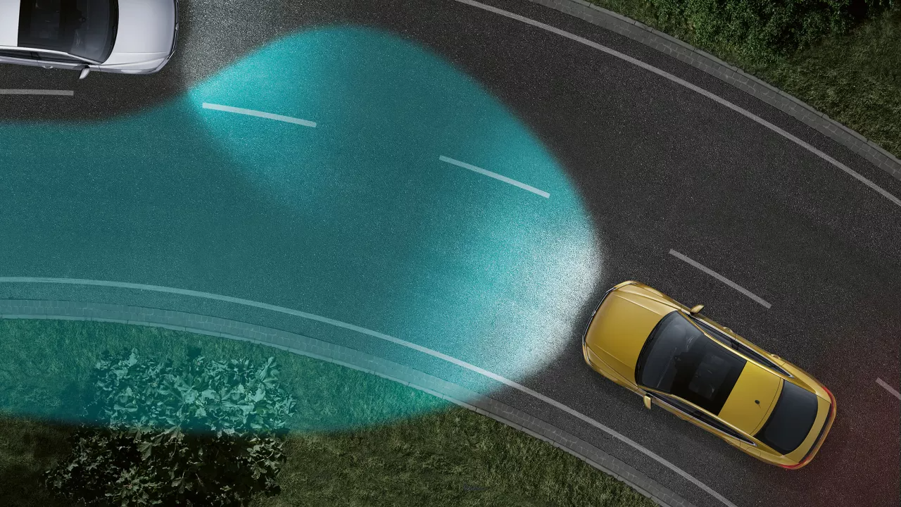 An image depicting dynamic cornering lights being triggered on an incoming corner on the road.