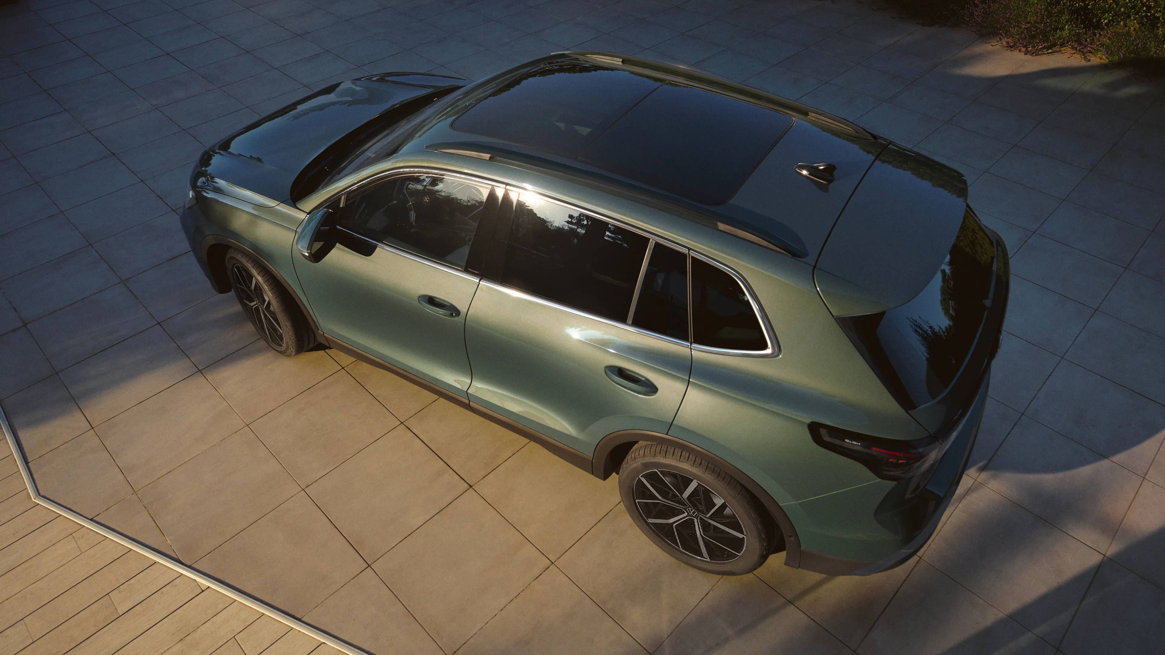 A shot taken from above on a metallic green Volkswagen Tiguan.