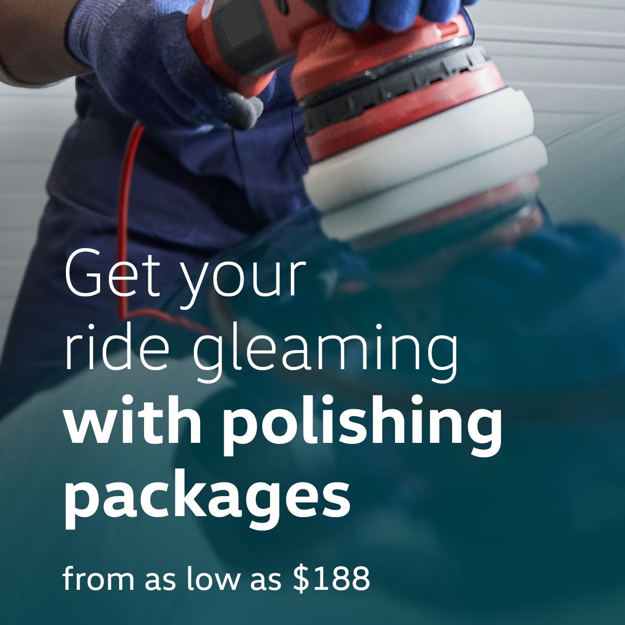 A Certified Volkswagen Staff wearing a pair of safety gloves polishing a Volkswagen vehicle using a commercial grade polisher.