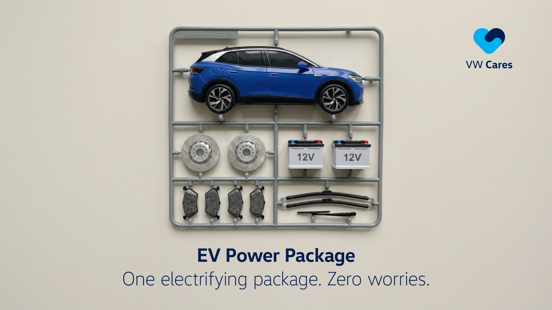 A blue electric vehicle laid out with its parts