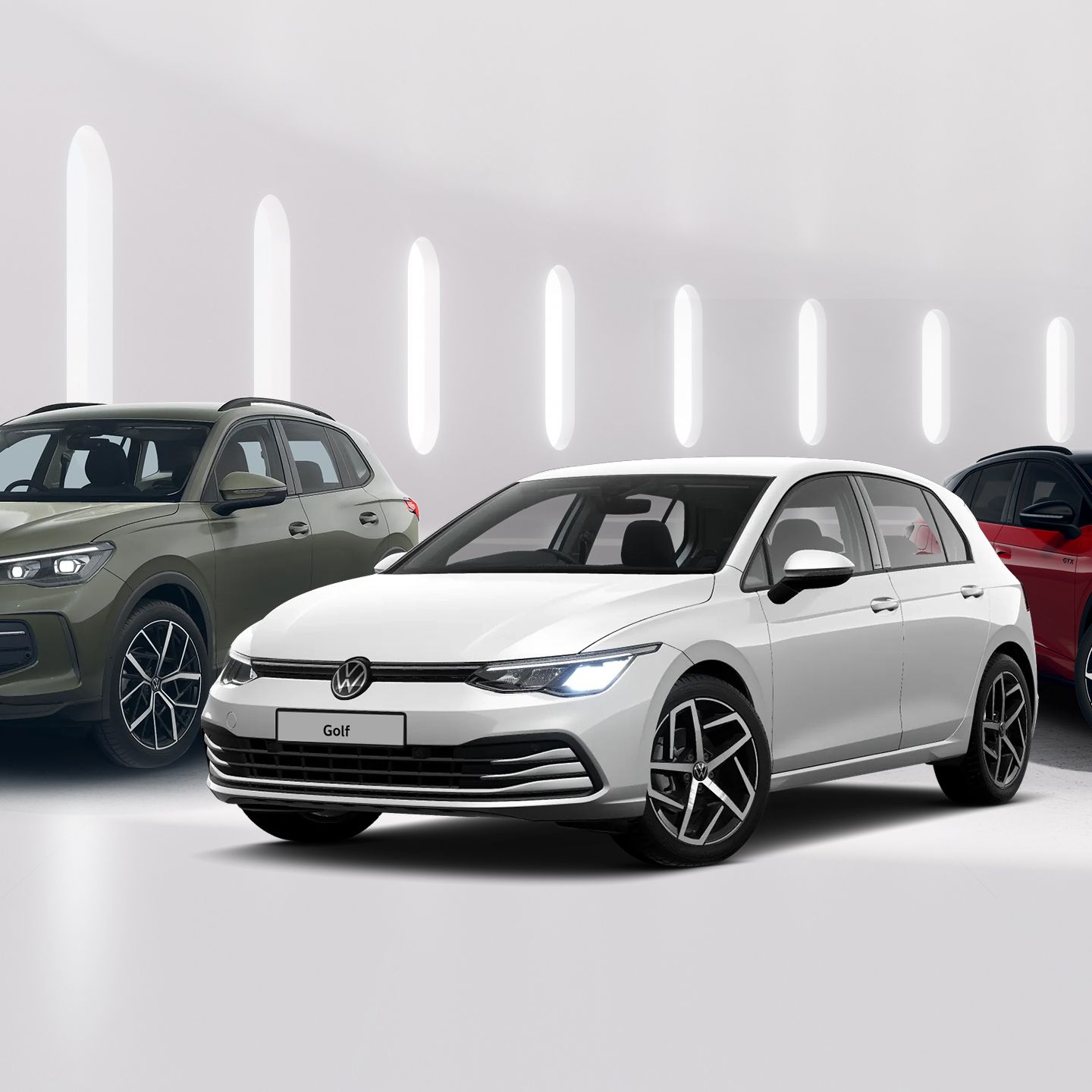 A white Volkswagen Golf, green Tiguan and red ID.4 GTX are displayed alongside each other against a minimalistic white background.