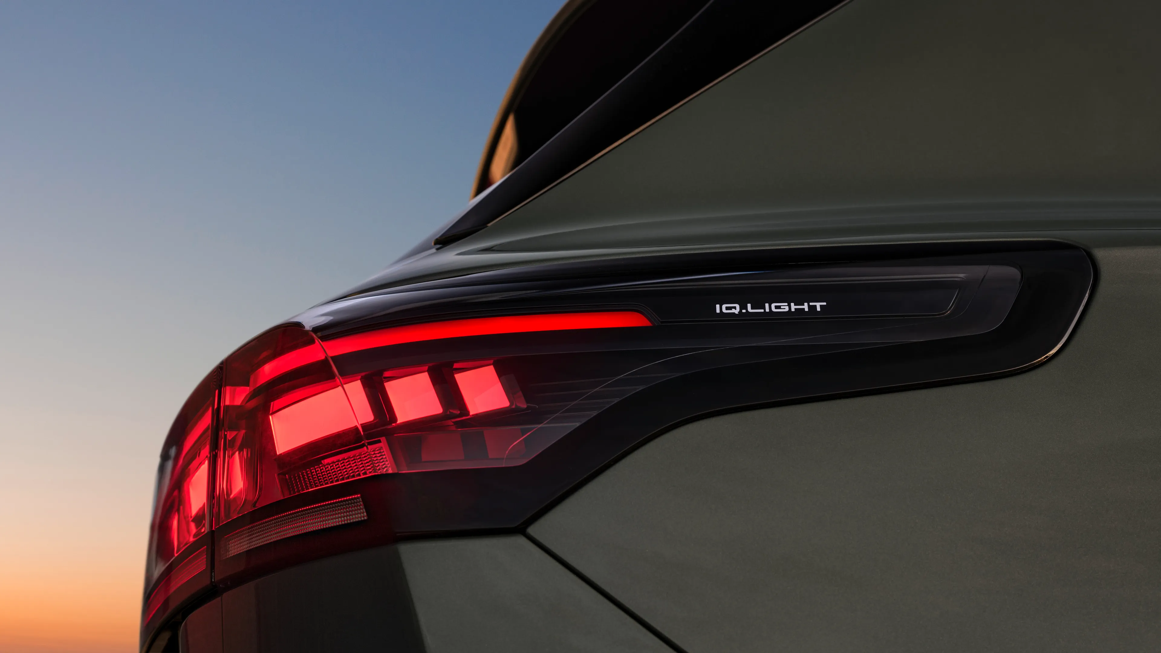 A close-up look of rear of a green Volkswagen Tiguan highlighting its LED rear lights.