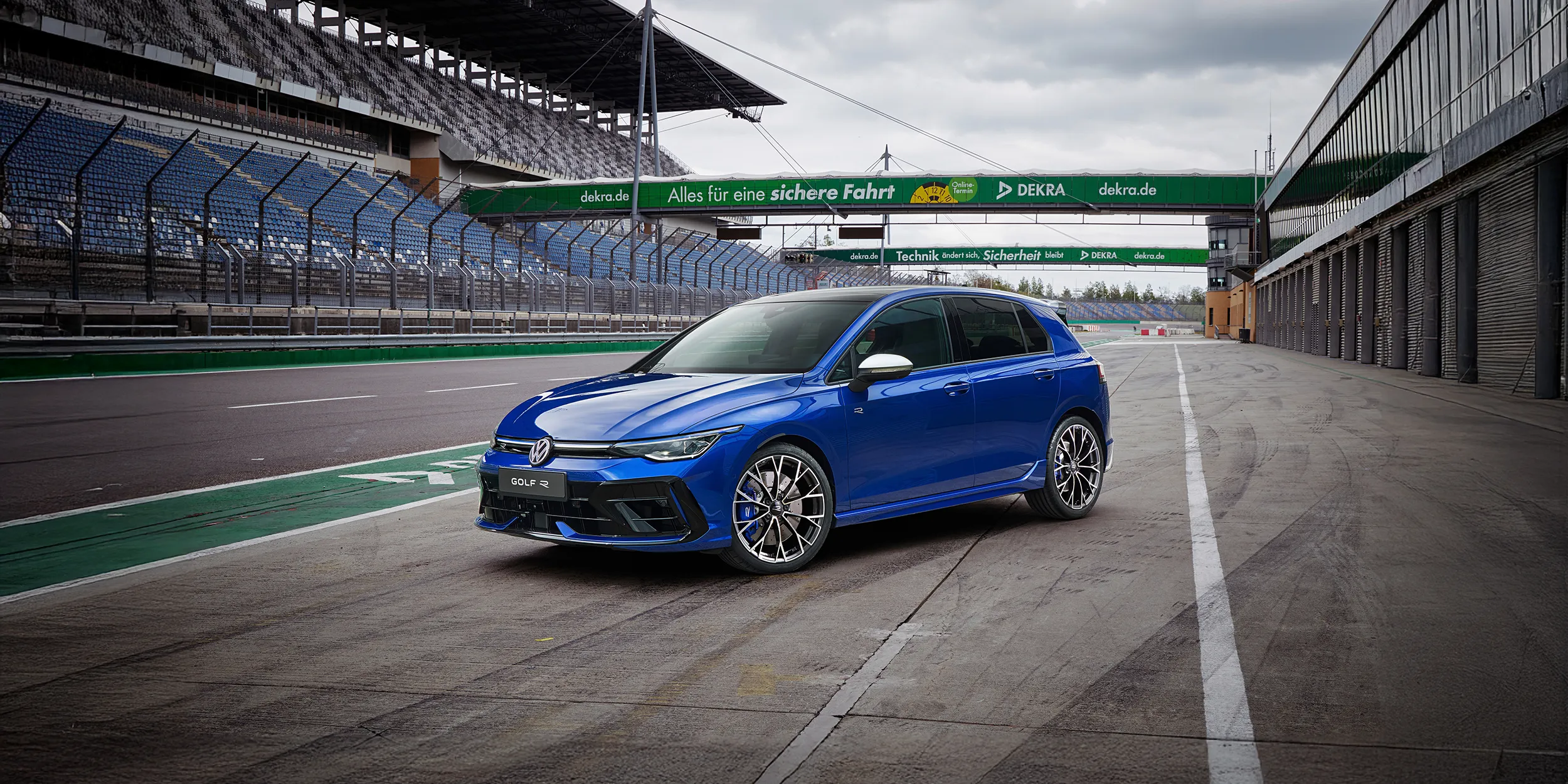 A blue Golf R parked on a race track