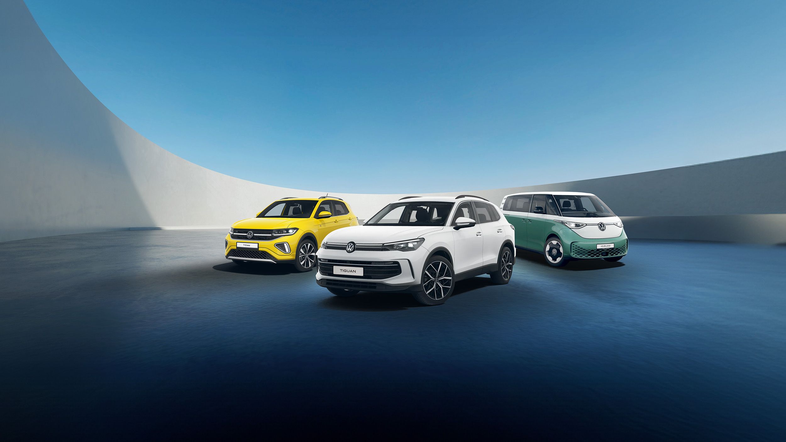 A white Tiguan, yellow T-Cross and candy white green ID. Buzz against a futuristic parking spot