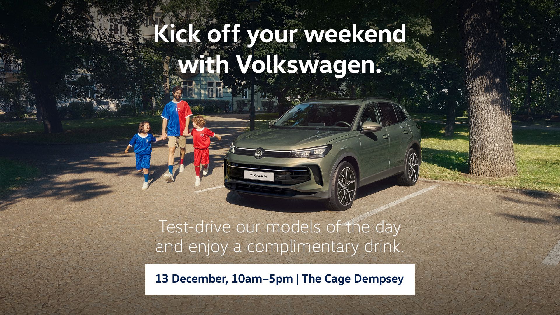 A family of three walking merrily by their trusty Tiguan