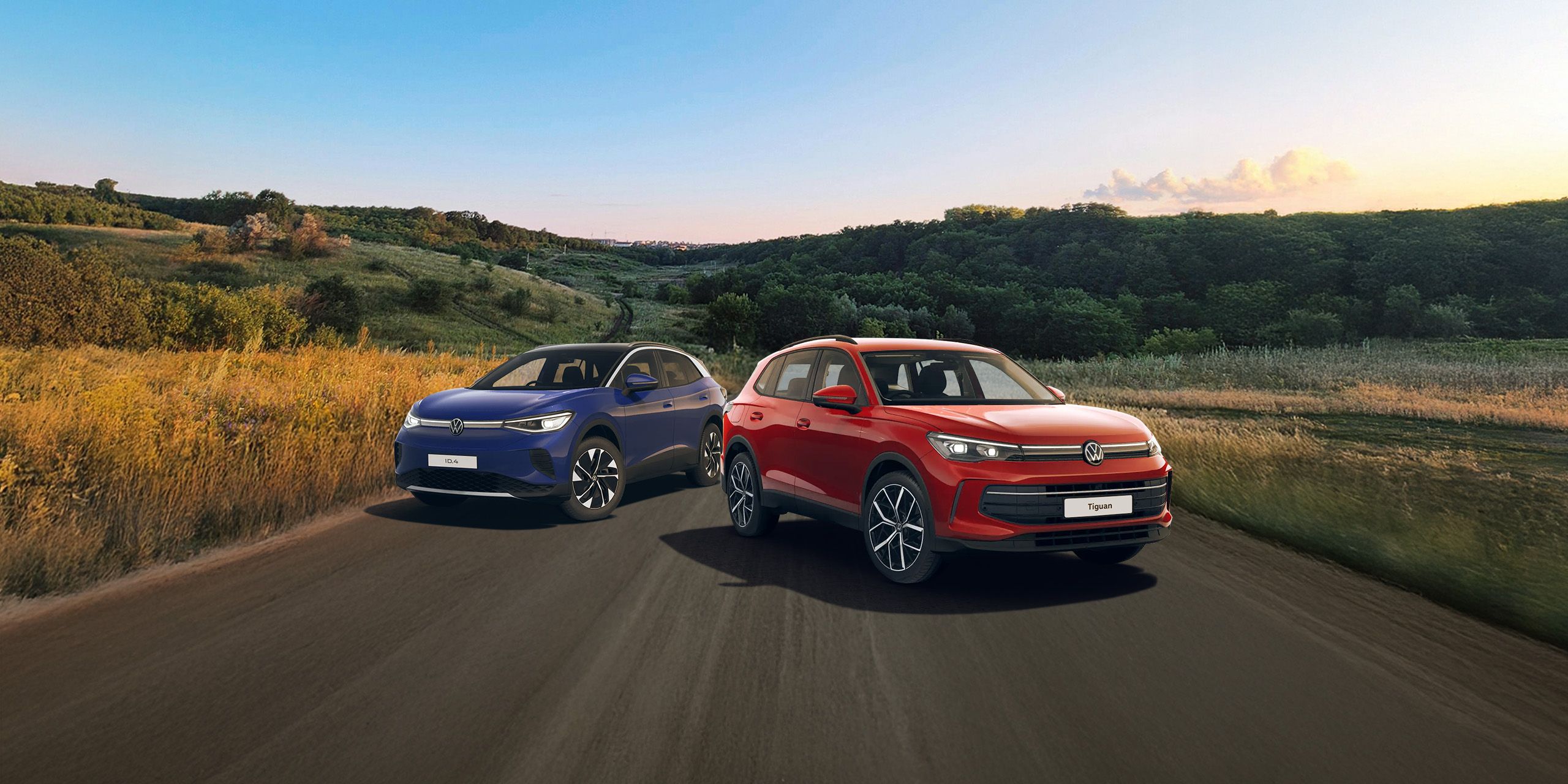 A blue ID.4 and red Tiguan showcased against a scenic road trail