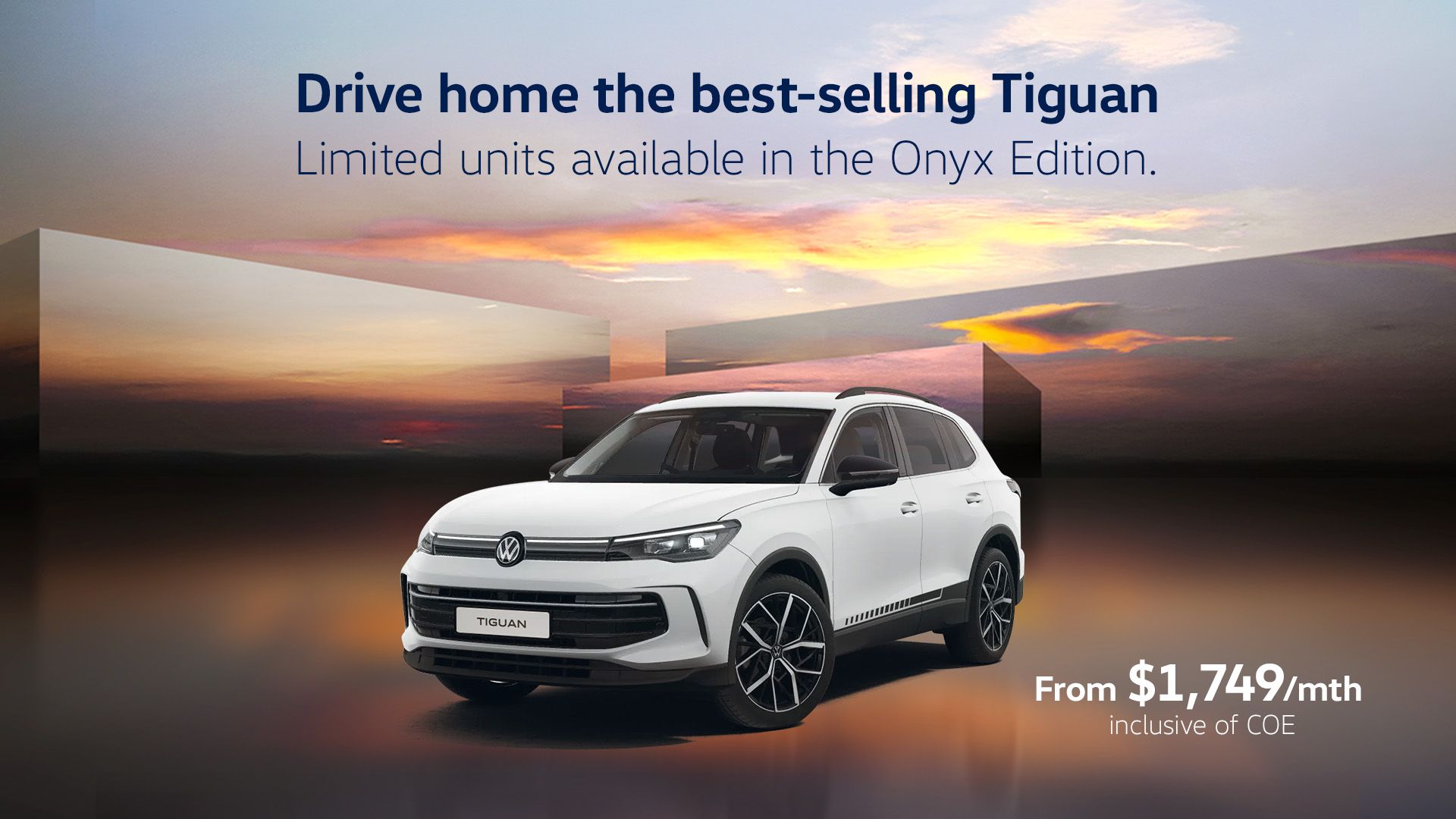 A white Tiguan showcased against a beautiful sunset