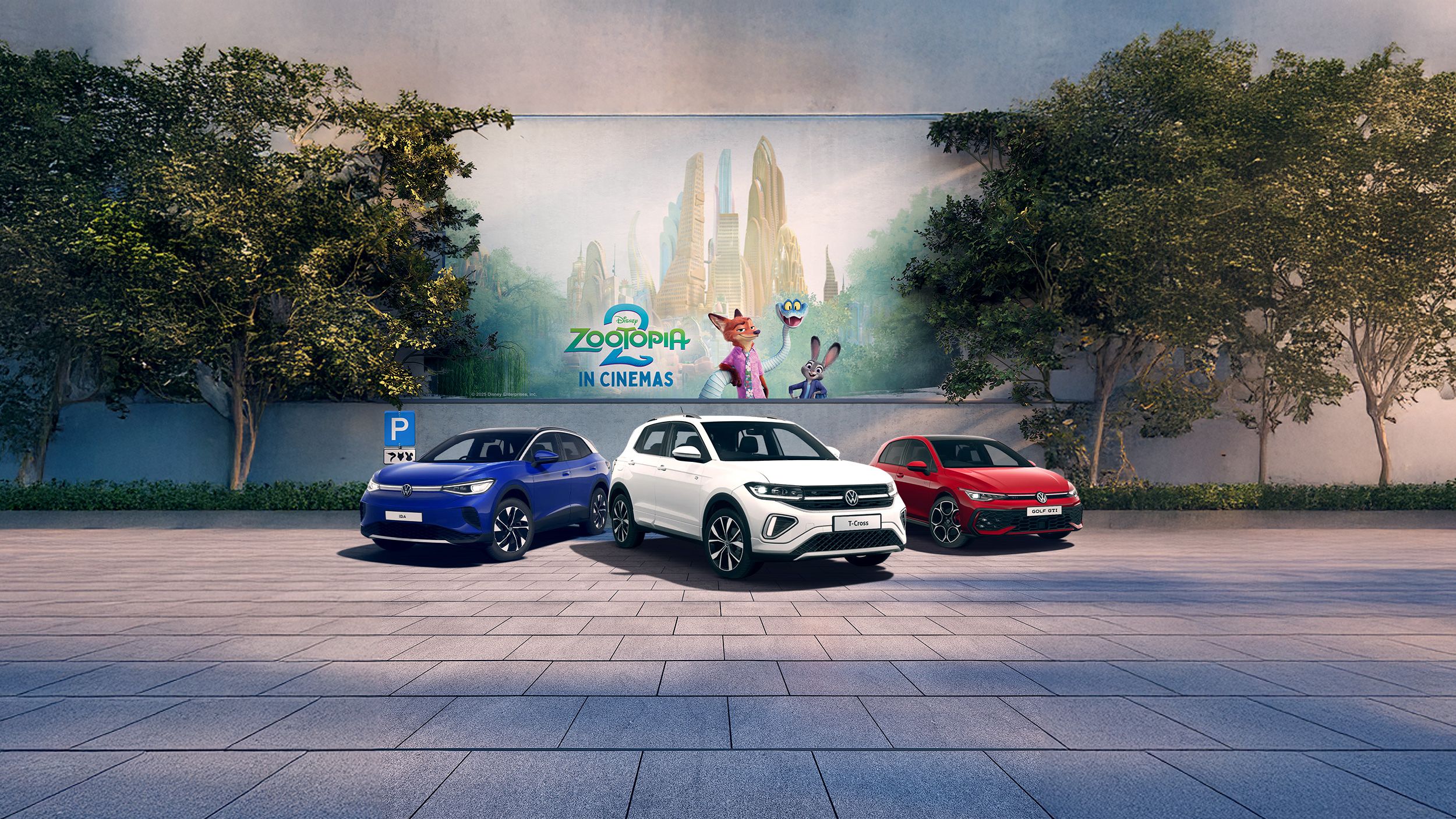 A blue ID.4, white T-Cross and red Golf GTI parked in front of a Zootopia 2 mural
