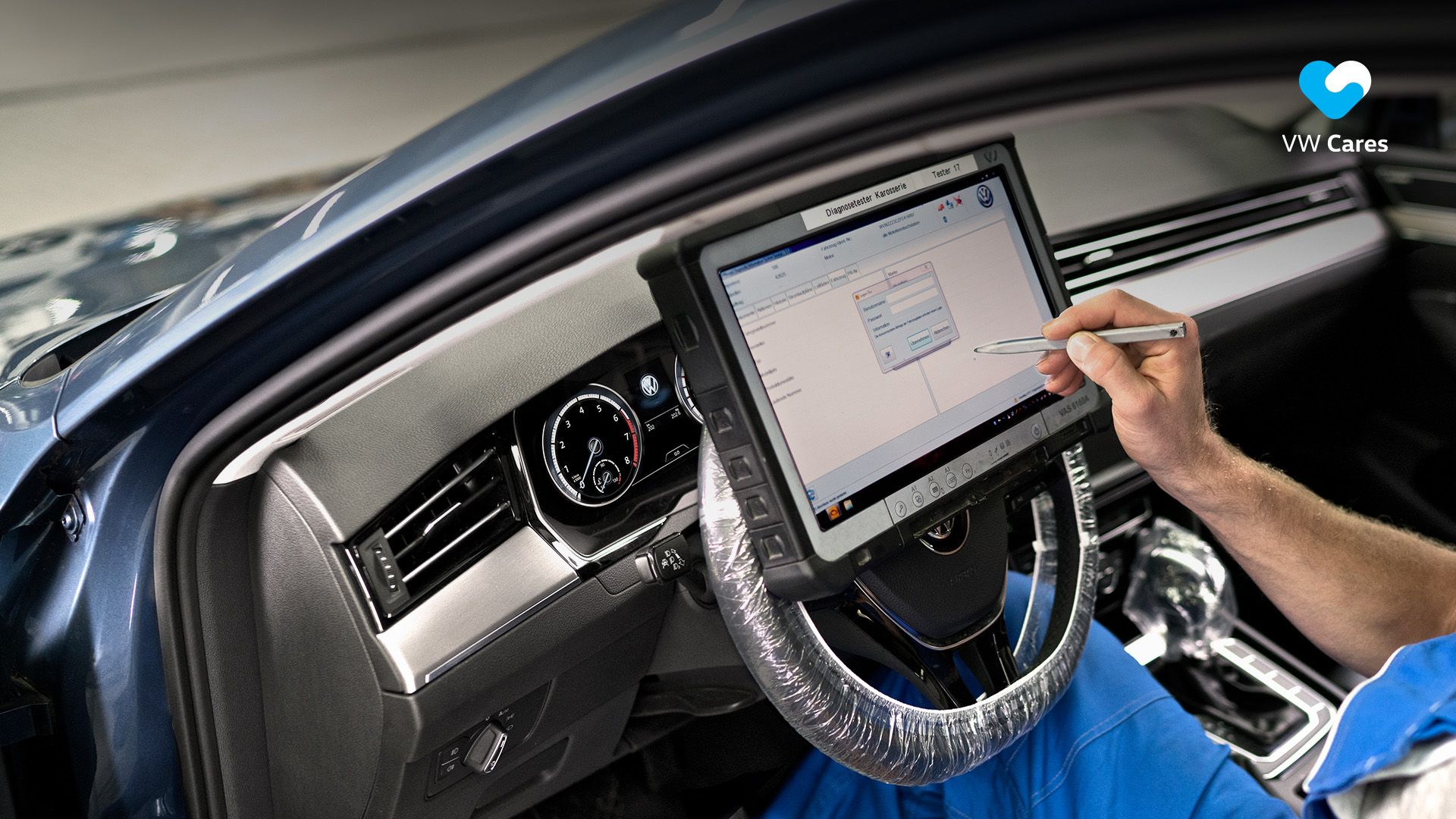 A certified Volkswagen technician calibrating a display in a Volkswagen vehicle