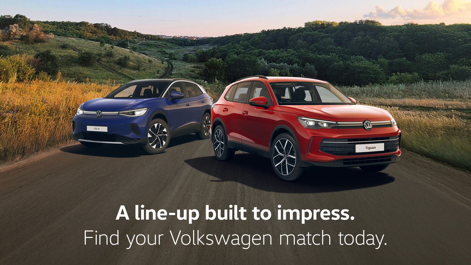 A blue ID.4 and red Tiguan showcased against a scenic road trail