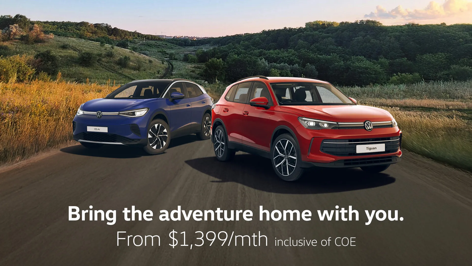 A blue ID.4 and red Tiguan showcased against a scenic road trail