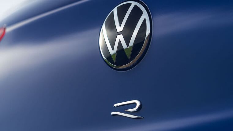 The blue vehicle with the logo of Volkswagen and the symbol of the Golf R 