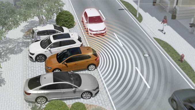 The Volkswagen vehicle reversing out of a parking spot or backing out of a driveway with the rear cross traffic alert by helping hit the brakes when collision are detected