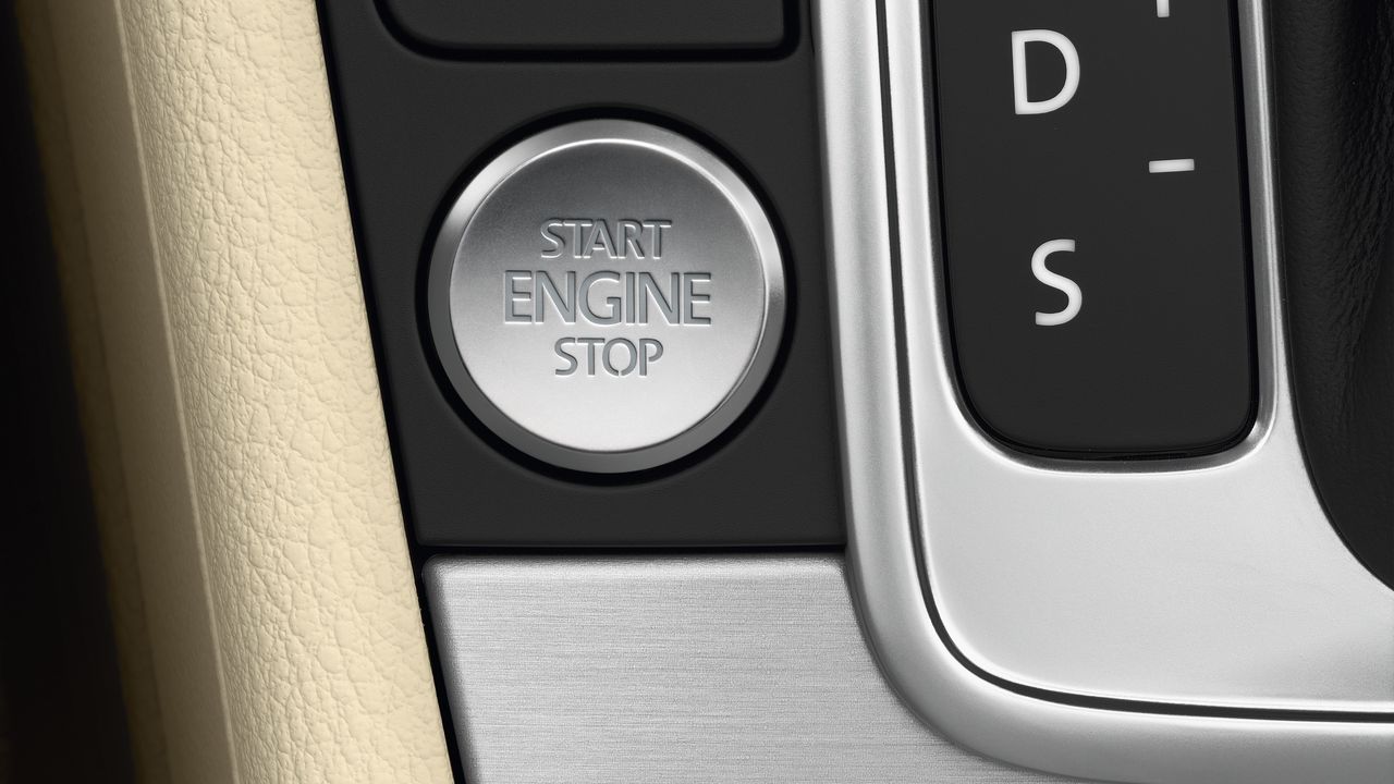 A close-up look of the Stop-Start button at the driver's central console area in a Volkswagen vehicle.