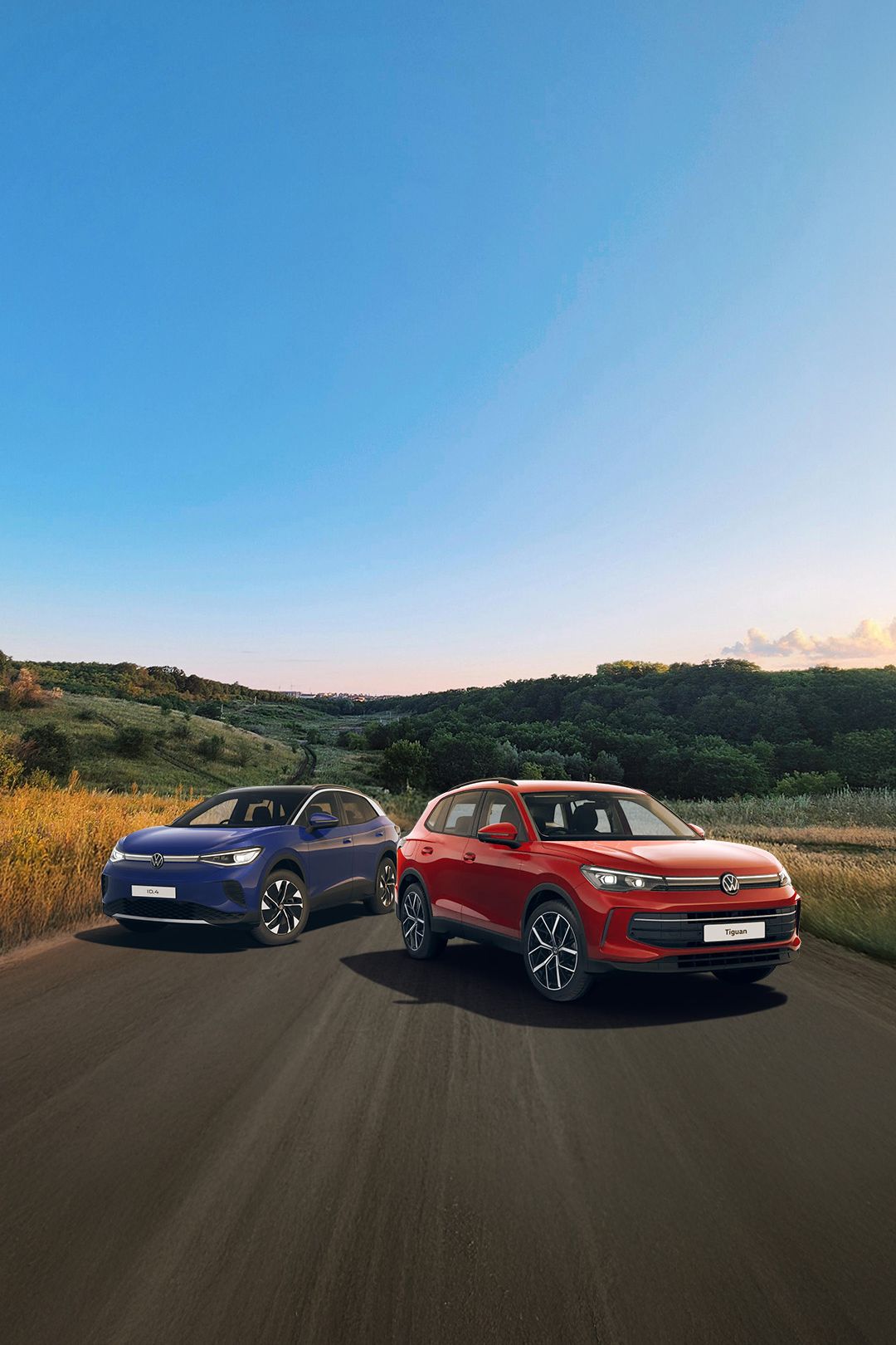 A blue ID.4 and red Tiguan showcased against a scenic road trail
