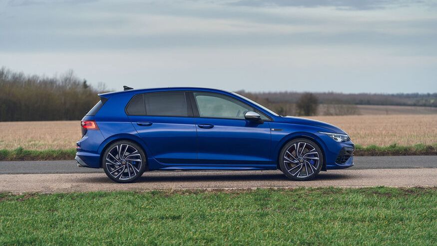 The blue Volkswagen Golf with R with the 'Estoril' alloy wheel aerodynamic parked beside the land