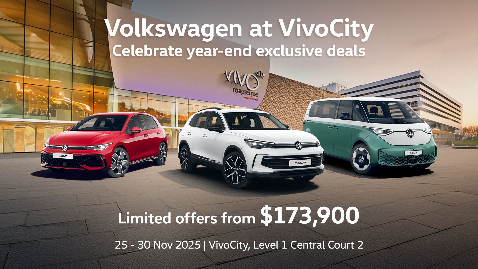 A red Golf, white Tiguan and a candy white and green ID. Buzz parked in front of the VivoCity facade