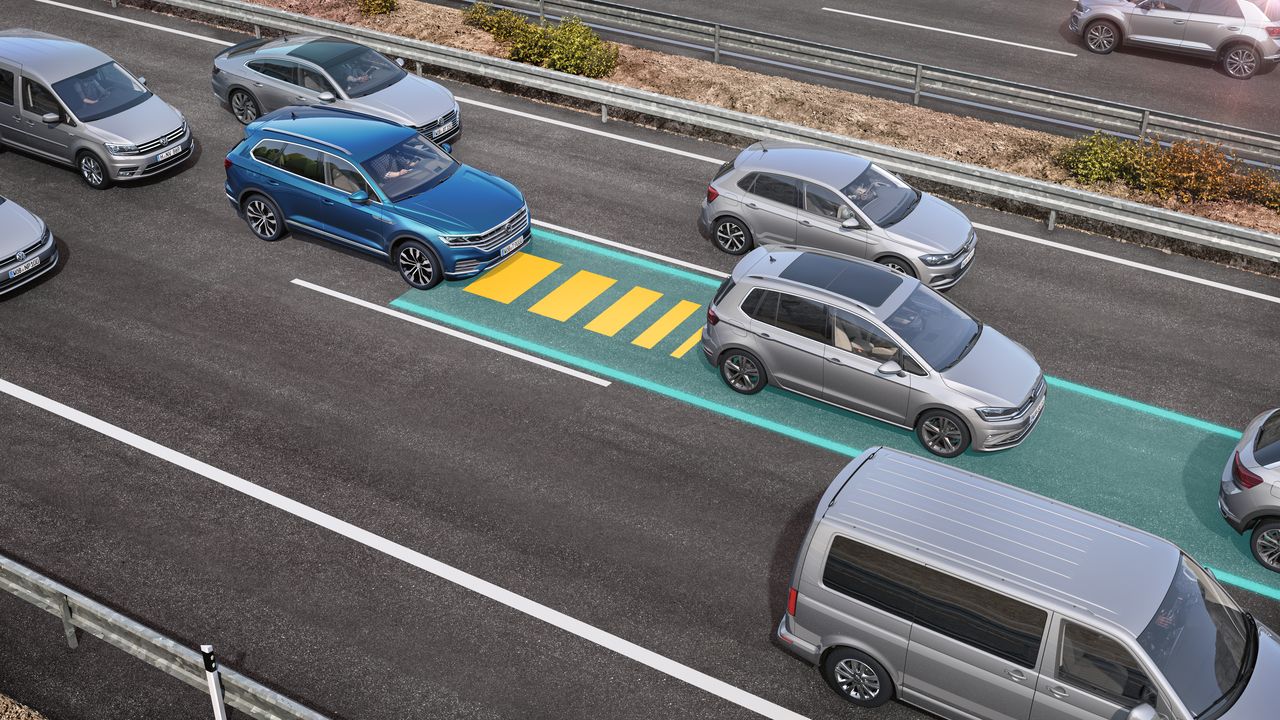 An image depicting Traffic Jam Assist being triggered to allow easy slow driving in traffic jams.