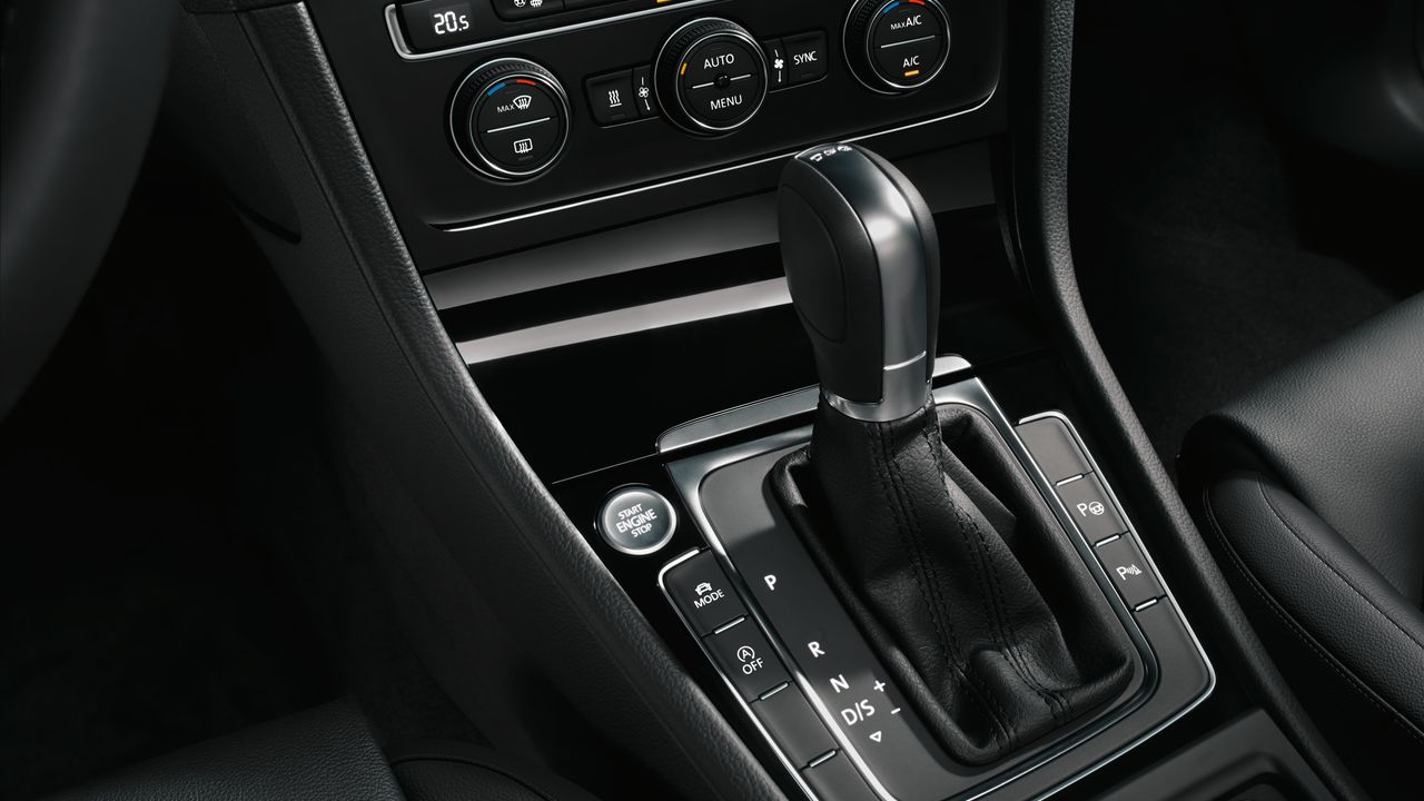 A view of a Volkswagen vehicle's interior central console system and features.